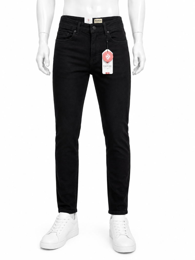 Black slim-fit jeans displayed on a white mannequin with white sneakers.
