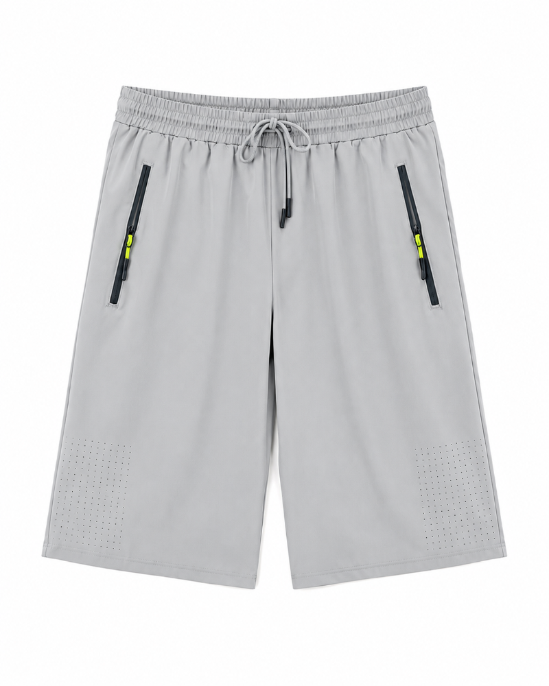 Light Green 100% China Imporetd shorts with an elastic drawstring waist, zippered side pockets, and perforated detailing near the lower legs.