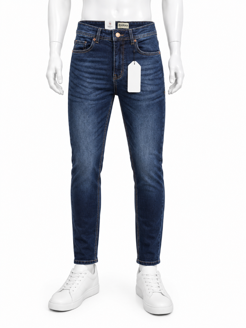 A pair of dark blue Regular-fit jeans with a white hangtag, shown on a white mannequin wearing white sneakers.