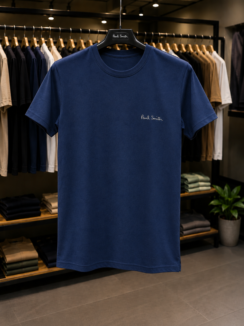 A Blue t-shirt with 'Paul Smith' in 100% Cotton.