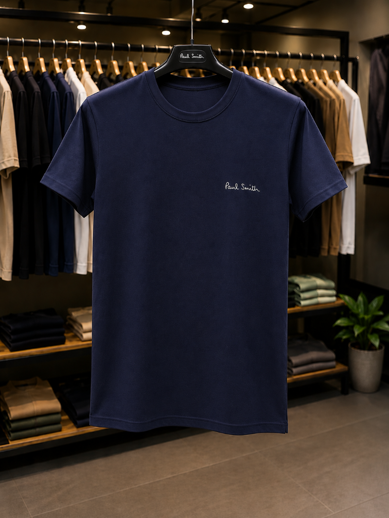 A Neavy Blue t-shirt with 'Paul Smith' in 100% Cotton.