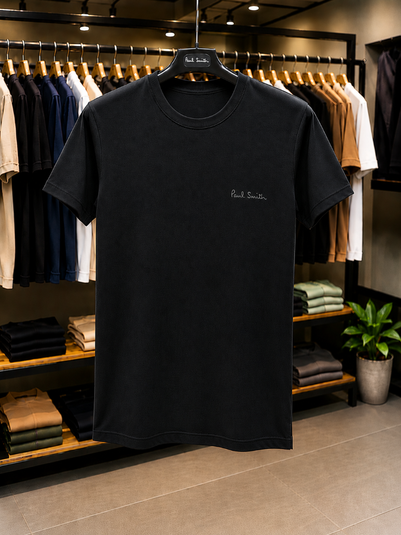 A Black t-shirt with 'Paul Smith' in 100% Cotton.
