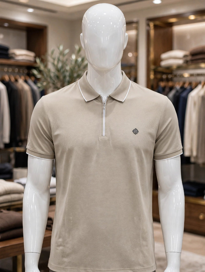 A beige men's short-sleeve polo shirt with a half-zip collar and a small embroidered logo on the chest.