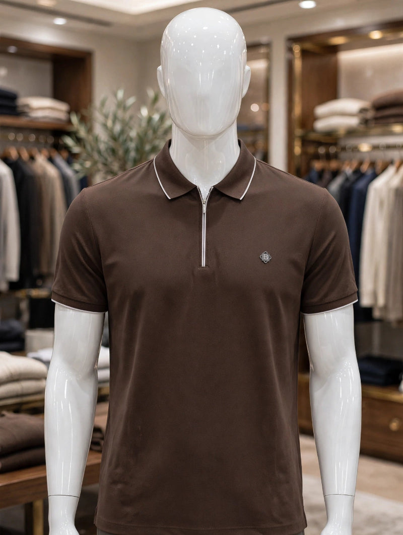 A mannequin wearing a brown short-sleeve polo shirt with a half-zip collar and white piping.